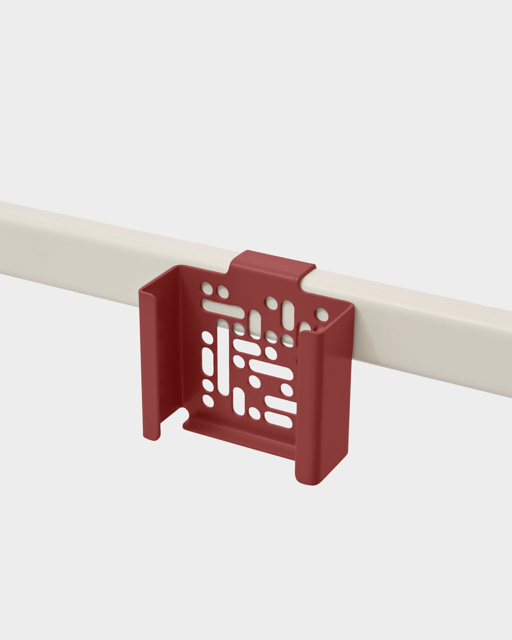 Burnin' Red Apple TV 4K Mount with vented cutouts, clipped onto a beige rail in a studio packshot at an angle