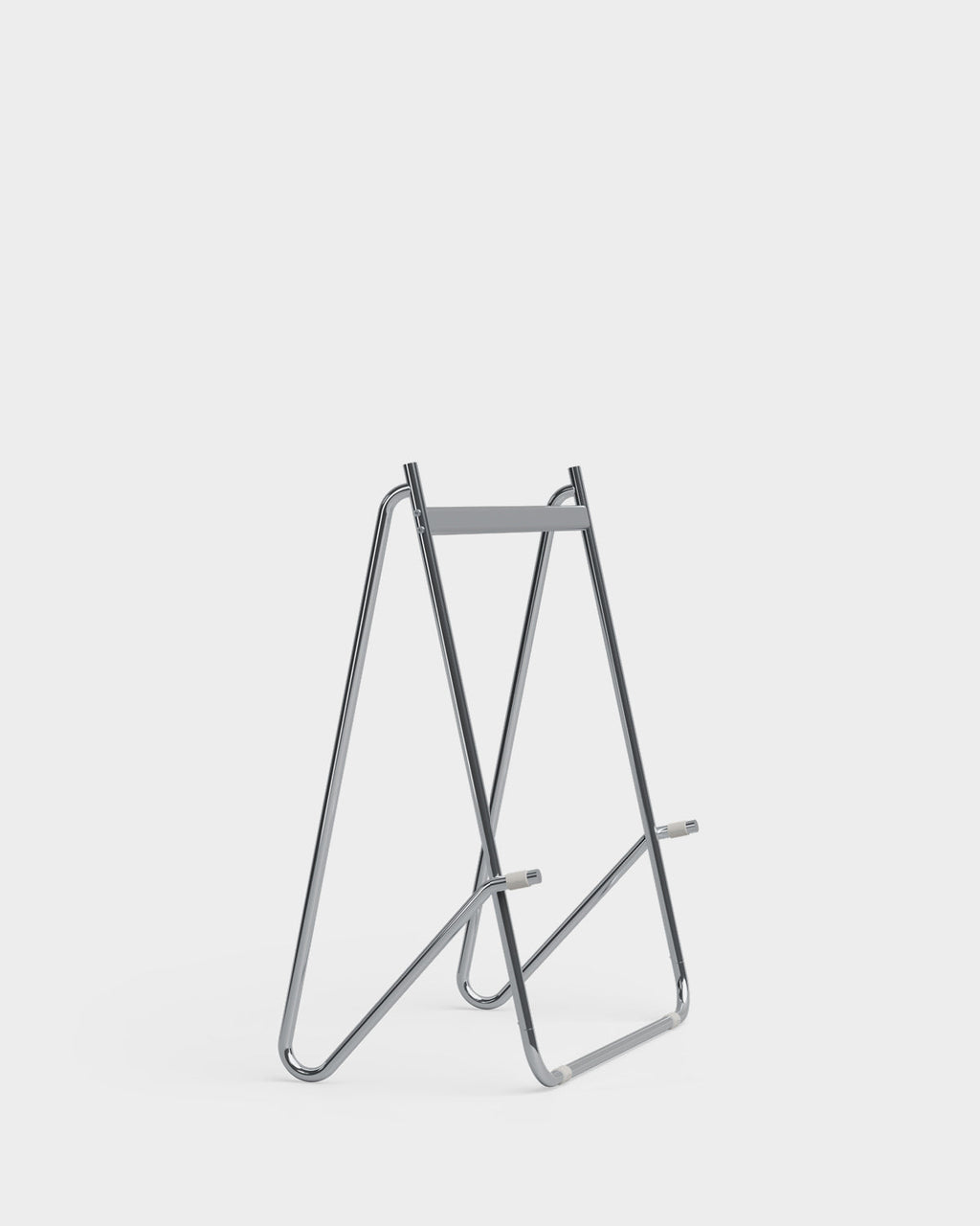 Bloom in Chrome low stand holding a black flat-screen TV at an angle, studio packshot on light grey background