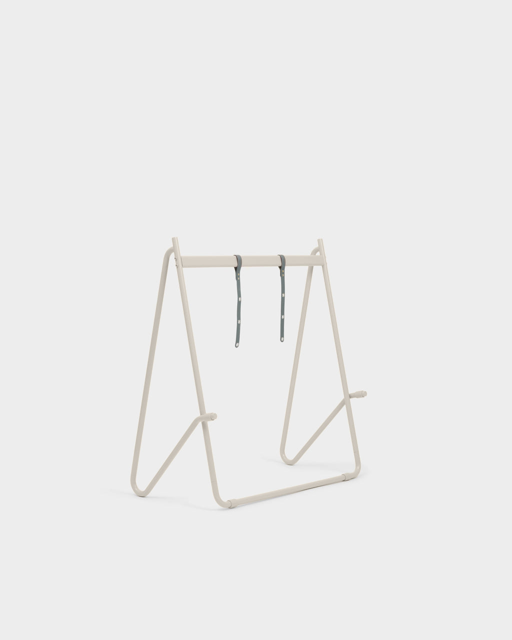 Bloom in Oat Stands Low shown from a three-quarter angle, bare A-frame with two grey hanging straps on white studio