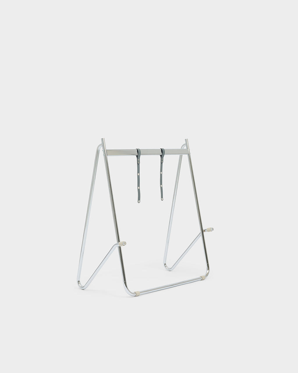 Bloom in Chrome low stand shown empty at an angle in a studio packshot, showing A-frame tubing and grey straps