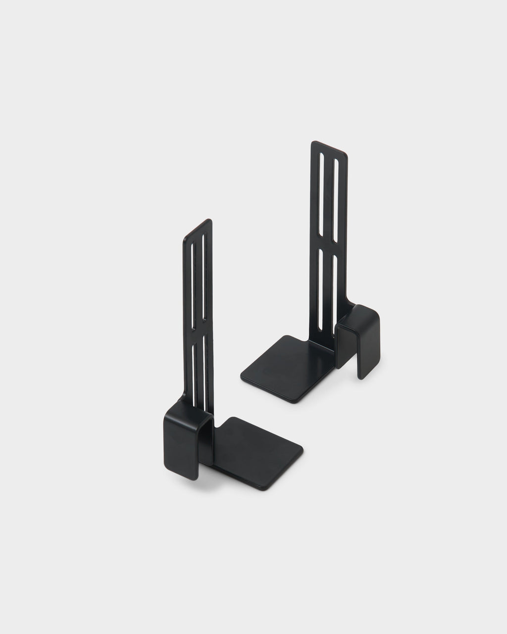 Pair of charcoal Box Mount brackets standing upright on a light studio background, angled to show slotted arms and L-shaped bases