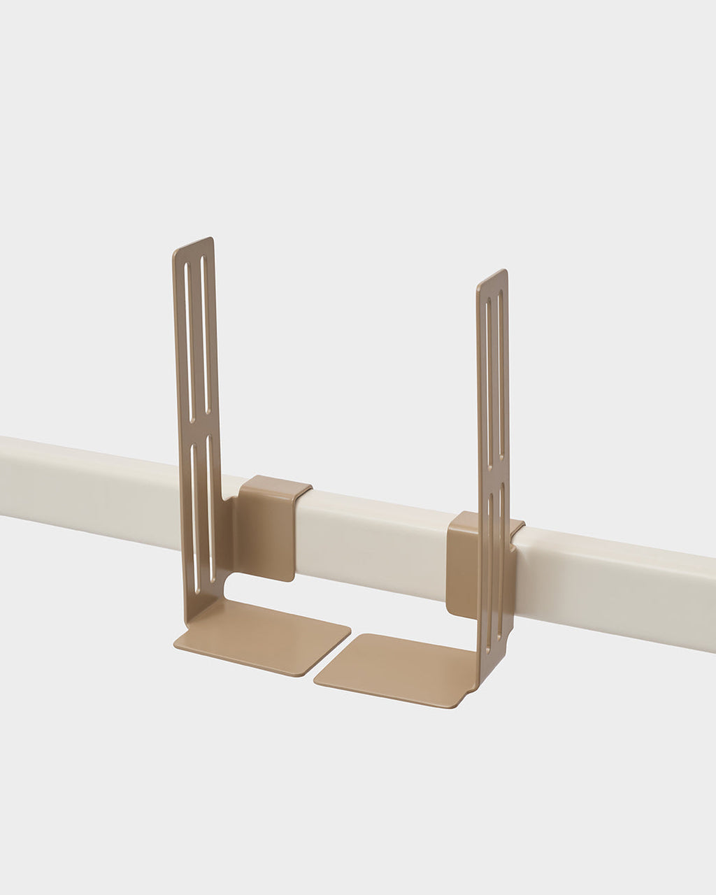Two Sandstorm Box Mount brackets clamped onto a white rail in a studio packshot, angled view with base plates below