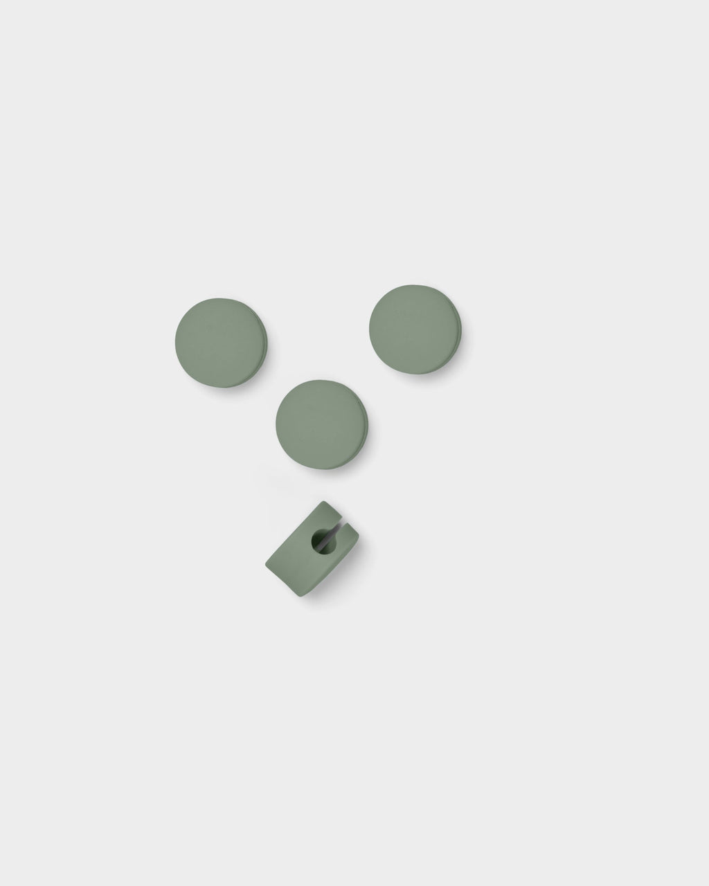 Mossy Green Cable Dots studio packshot: three round adhesive discs and one slotted cable clip on light grey background