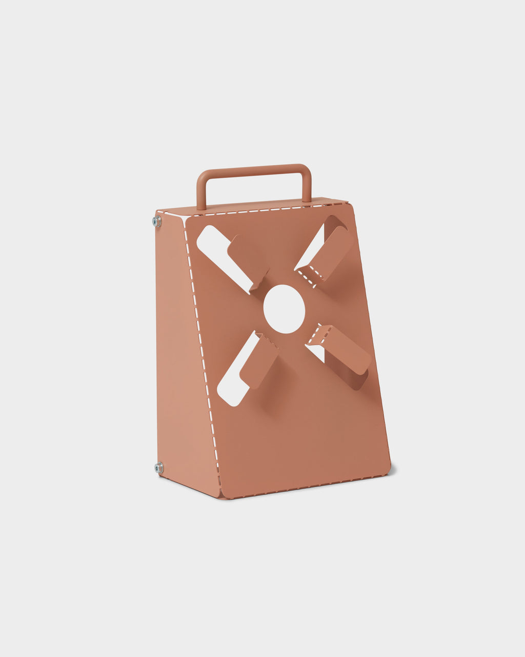 Angled studio packshot of the Dusty Rose Cable Stand, a tapered metal box with carry handle and cutout cable ports
