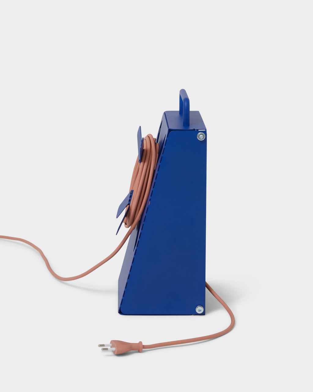 Side profile studio packshot of the Ultra Marine Cable Stand with salmon cord coiled on its rear cleat and plug trailing
