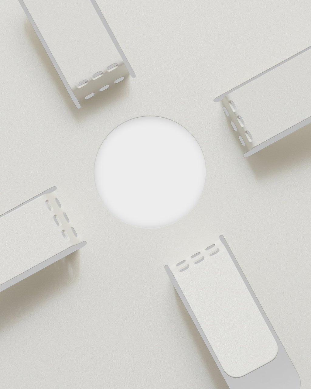 Pearl Cable Stand components arranged around a white disc on a light studio backdrop, flat-lay overhead view