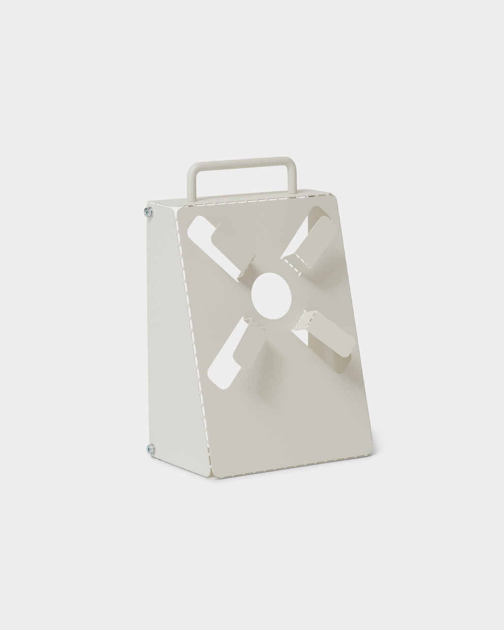 Angled studio packshot of the Cable Stand in Pearl, showing its folded metal body, cutout tabs and top carry handle