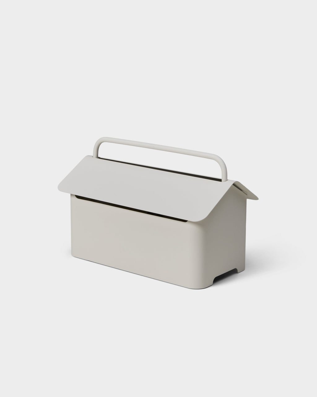 Cable Villa in Pearl shown at an angle in a studio packshot, house-shaped cable box with lid and carry handle