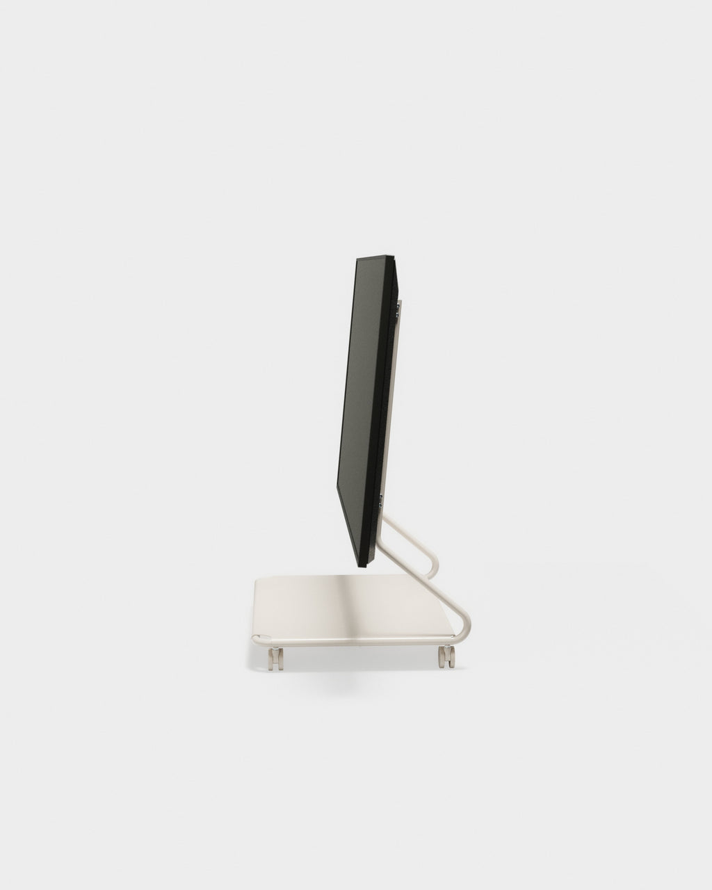 Side profile studio view of Disco stand with wheels in Oat, black flat screen mounted upright on tubular metal frame