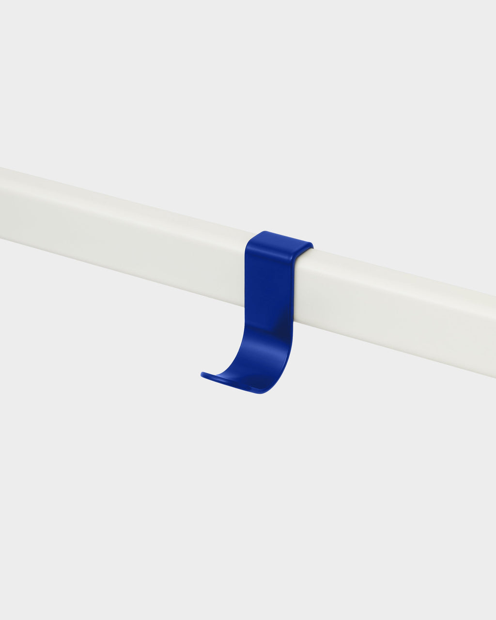 Ultra Marine Hook Mount clipped onto a white rail, studio packshot angled view showing curved hook profile