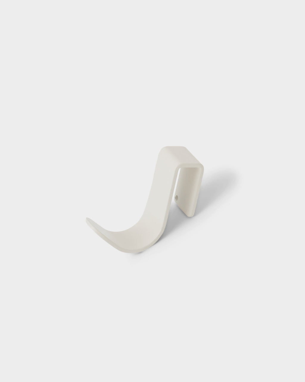 Hook Mount in Pearl shown at an angle in a studio packshot, highlighting its curved J-shape and wall plate
