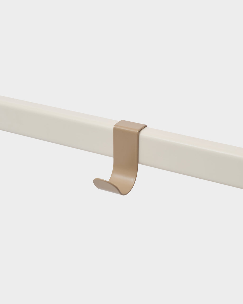 Sandstorm Hook Mount clipped onto a cream rail, studio packshot angled view showing the curved hook profile