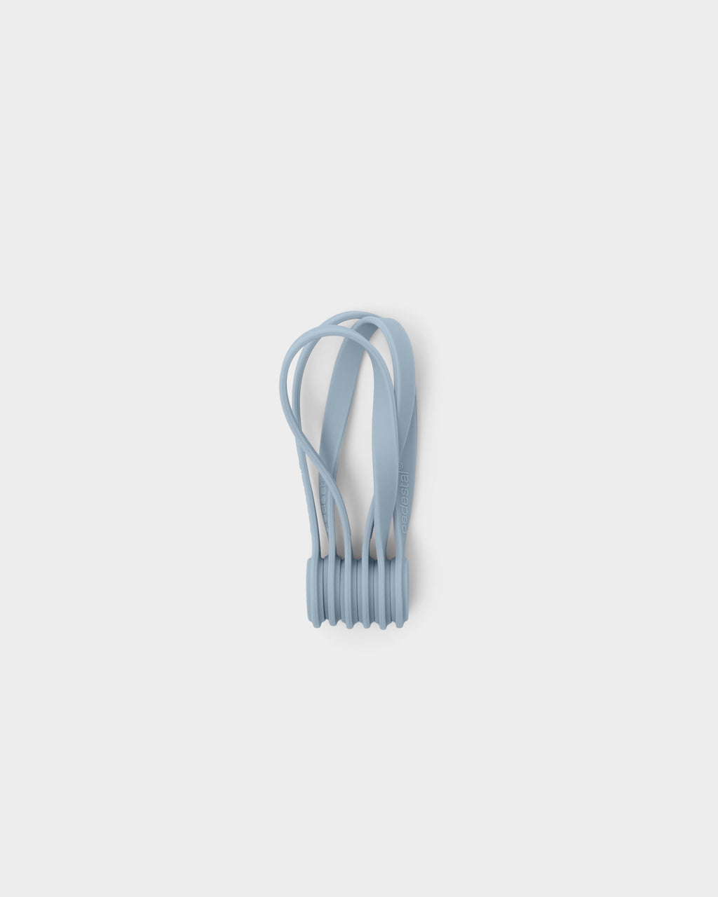 Set of Powder Blue Magnetic Cable Ties bundled together, studio packshot on light grey background showing looped silicone straps