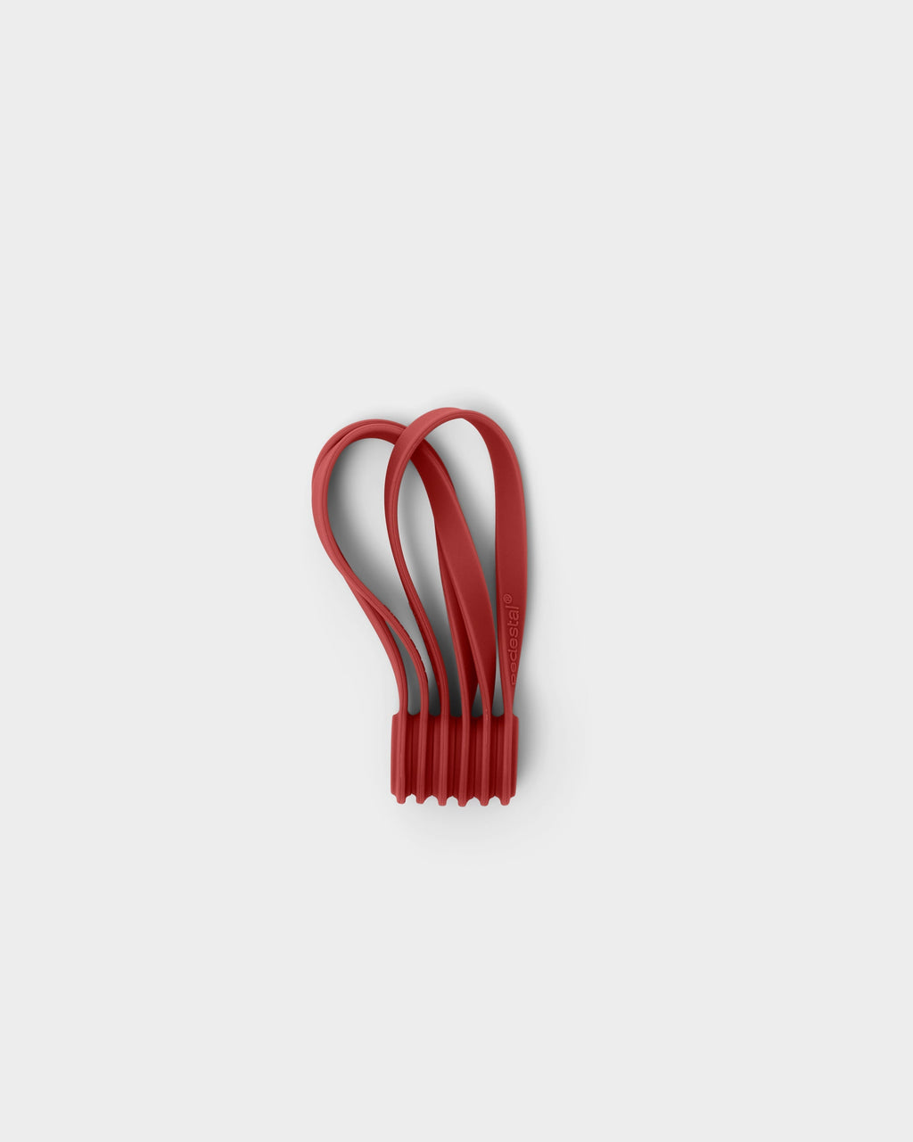 Burnin' Red magnetic cable ties bundled together in a studio packshot, looped silicone straps with ribbed base