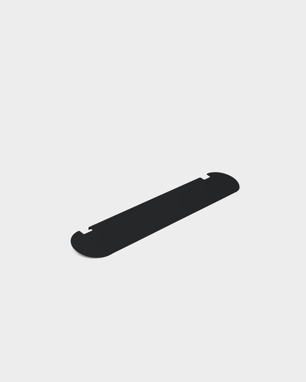 Moon Light Shelf in Charcoal shown at an angle in a studio packshot, slim rounded shelf with notched edge details
