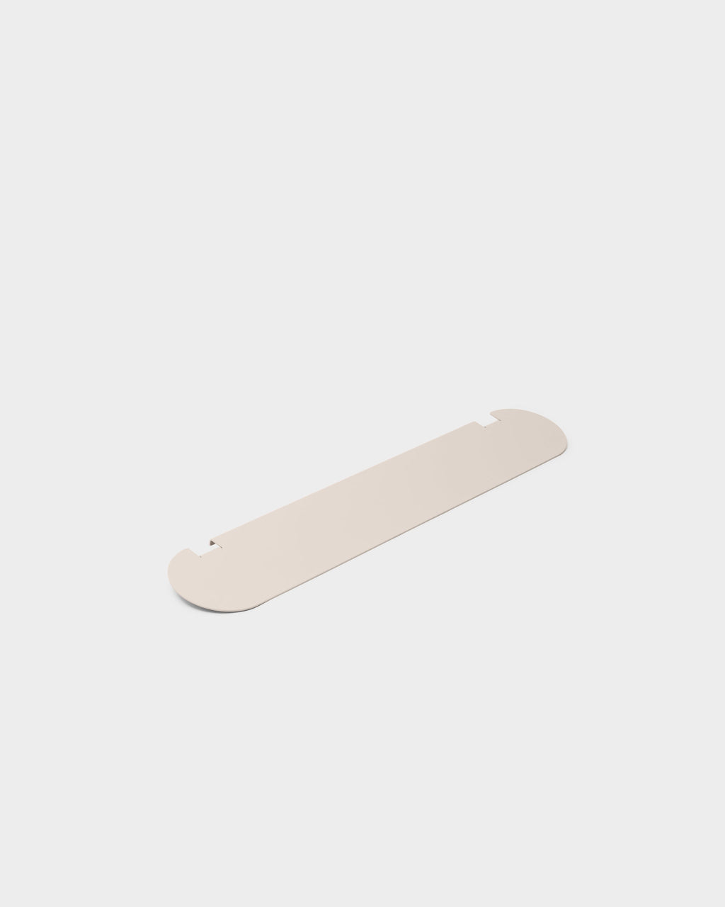 Moon Light Shelf in Oat shown at an angle in a studio packshot, flat rounded metal panel with notched edges