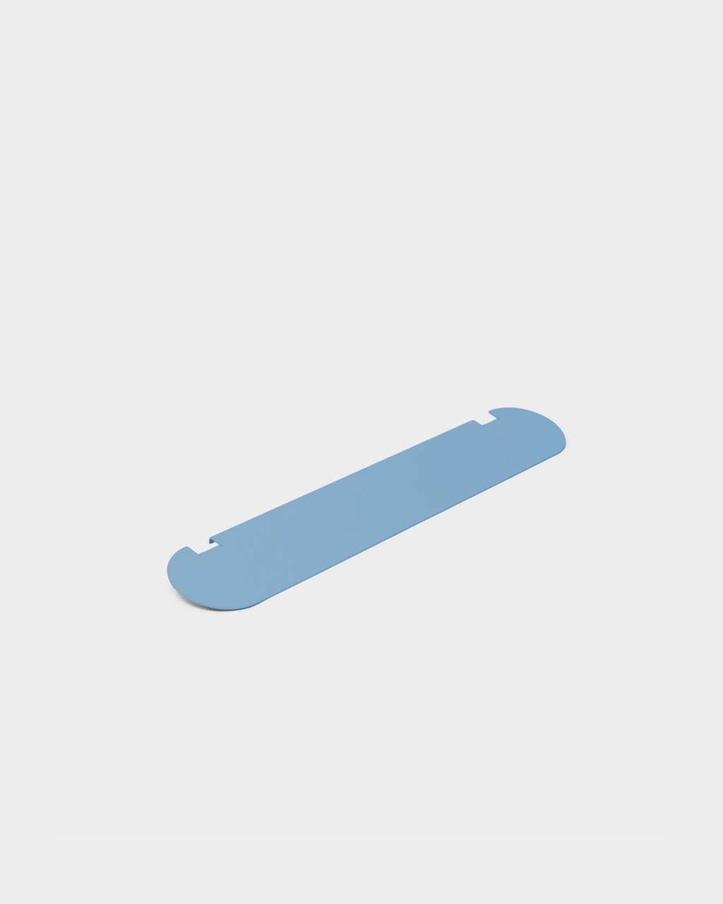 Moon Light Shelf in Powder Blue shown at an angle in a studio packshot, highlighting rounded ends and notched edges
