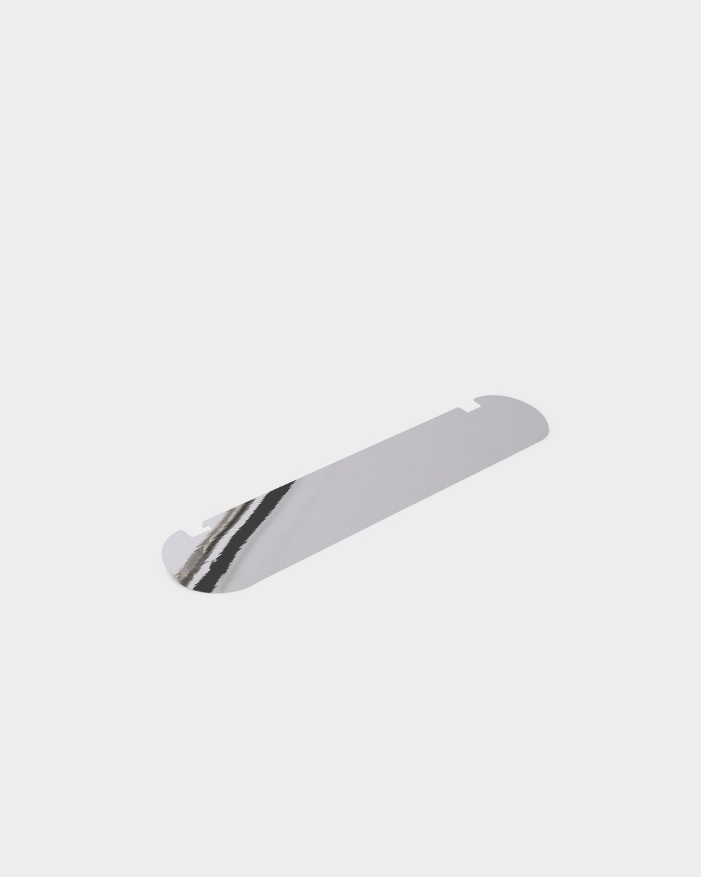 Moon Light Shelf in Chrome shown at an angle in a studio packshot, mirrored surface with rounded ends and notch