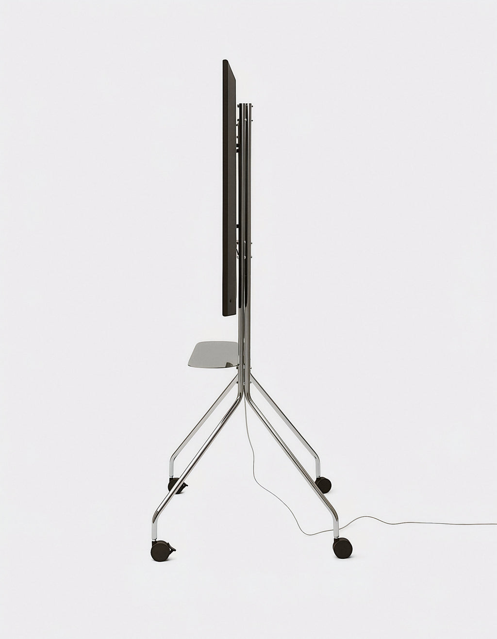 Side profile of Moon PRO TV stand in Chrome, studio shot with mounted screen, shelf, casters and trailing power cable