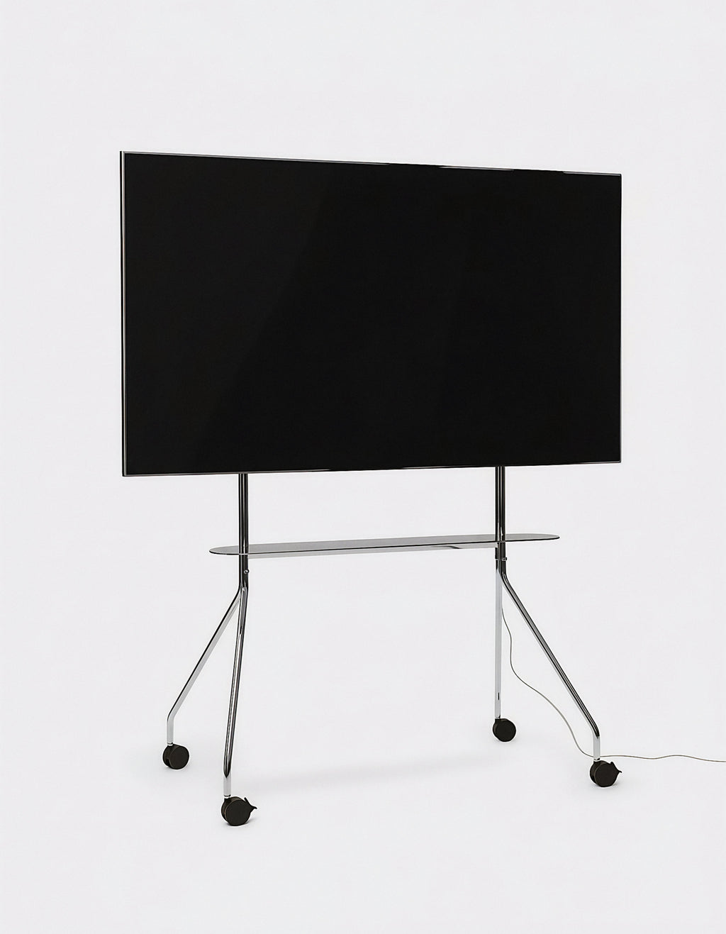 Moon PRO TV stand in Chrome holding a large flat-screen TV, studio shot showing slim legs, shelf and casters