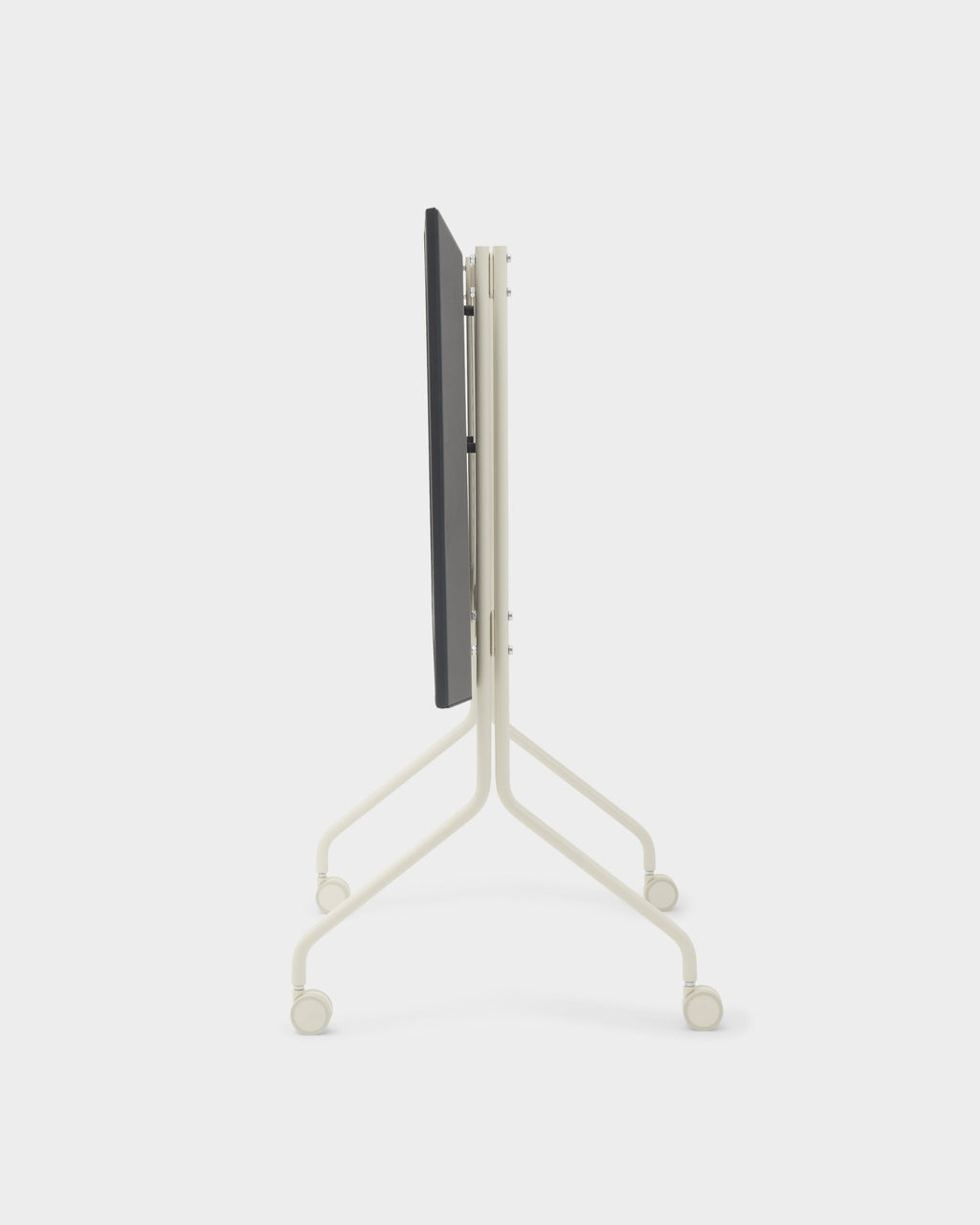 Moon stand in Pearl folded flat for storage, side-angle studio view showing slim frame and four lockable wheels