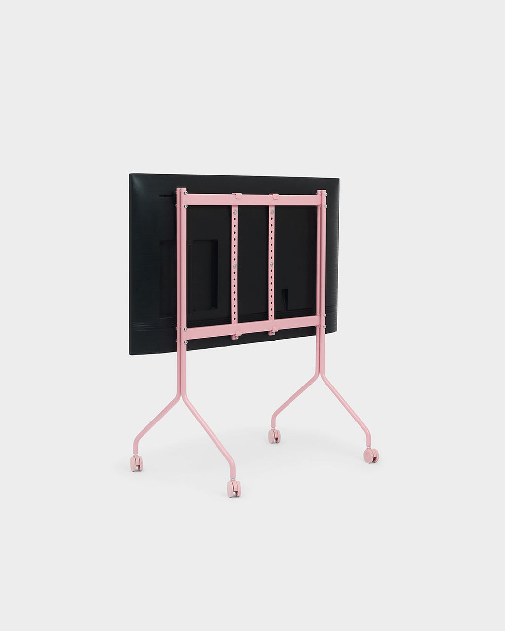 Rear view of the Moon TV stand in Bubble Gum pink on wheels, holding a mounted flat-screen, studio packshot