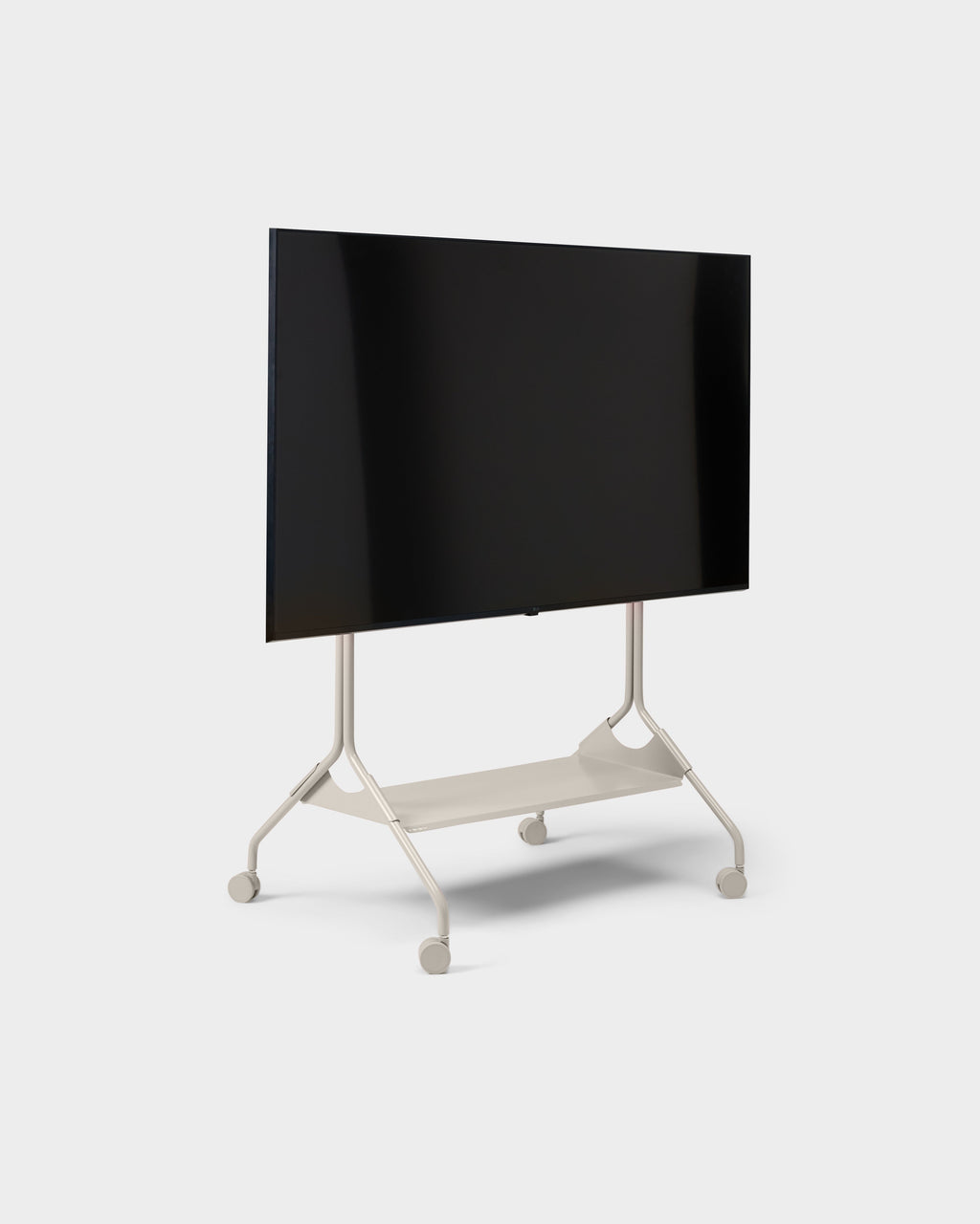 Moon Tall rolling TV stand in Oat, angled studio view with mounted flatscreen, lower shelf and locking caster wheels