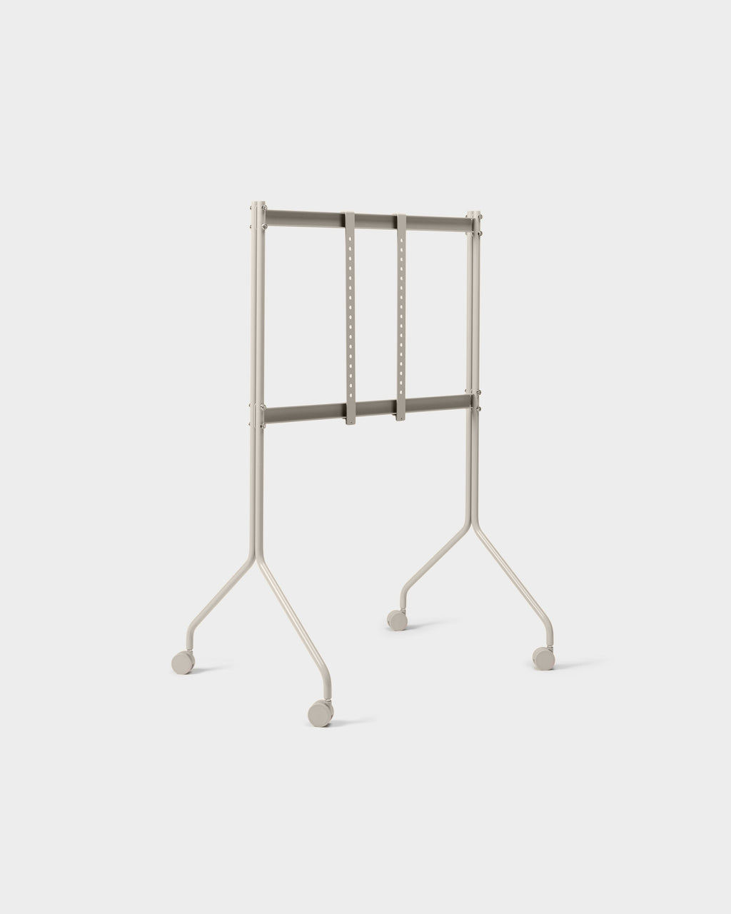 Moon Tall TV stand in Oat shown at a three-quarter angle in studio, empty mount brackets and four caster wheels