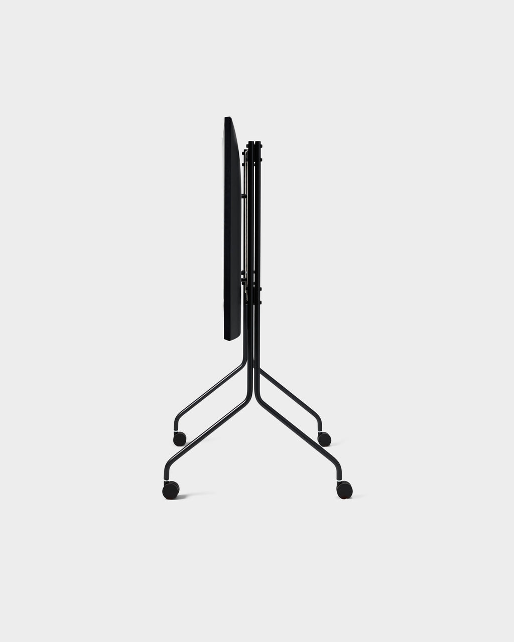 Moon Tall stand in Charcoal folded flat, side-on studio view showing slim frame and four locking wheels