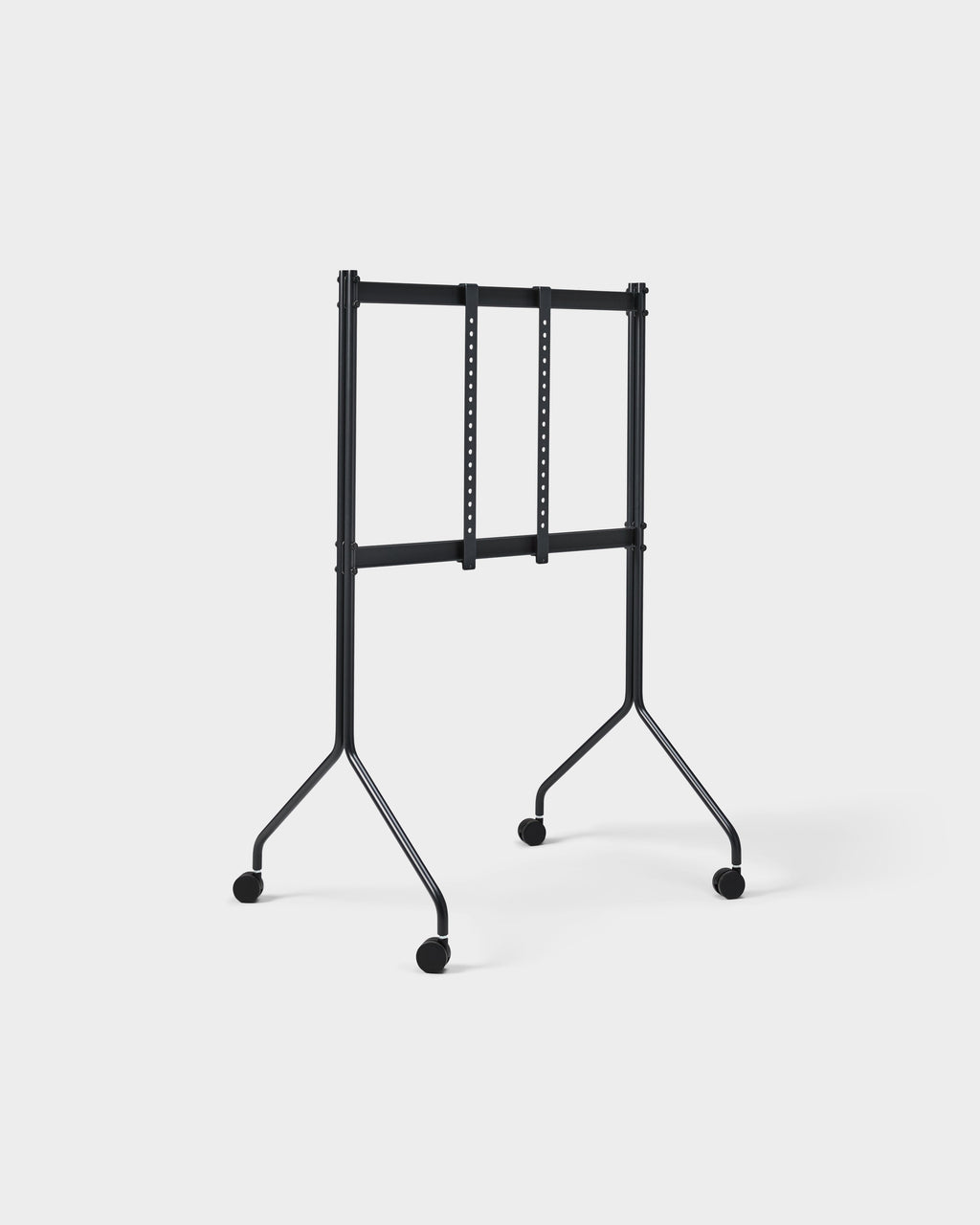 Moon Tall TV stand in Charcoal shown at an angle in a studio, empty mounting brackets and rolling caster wheels