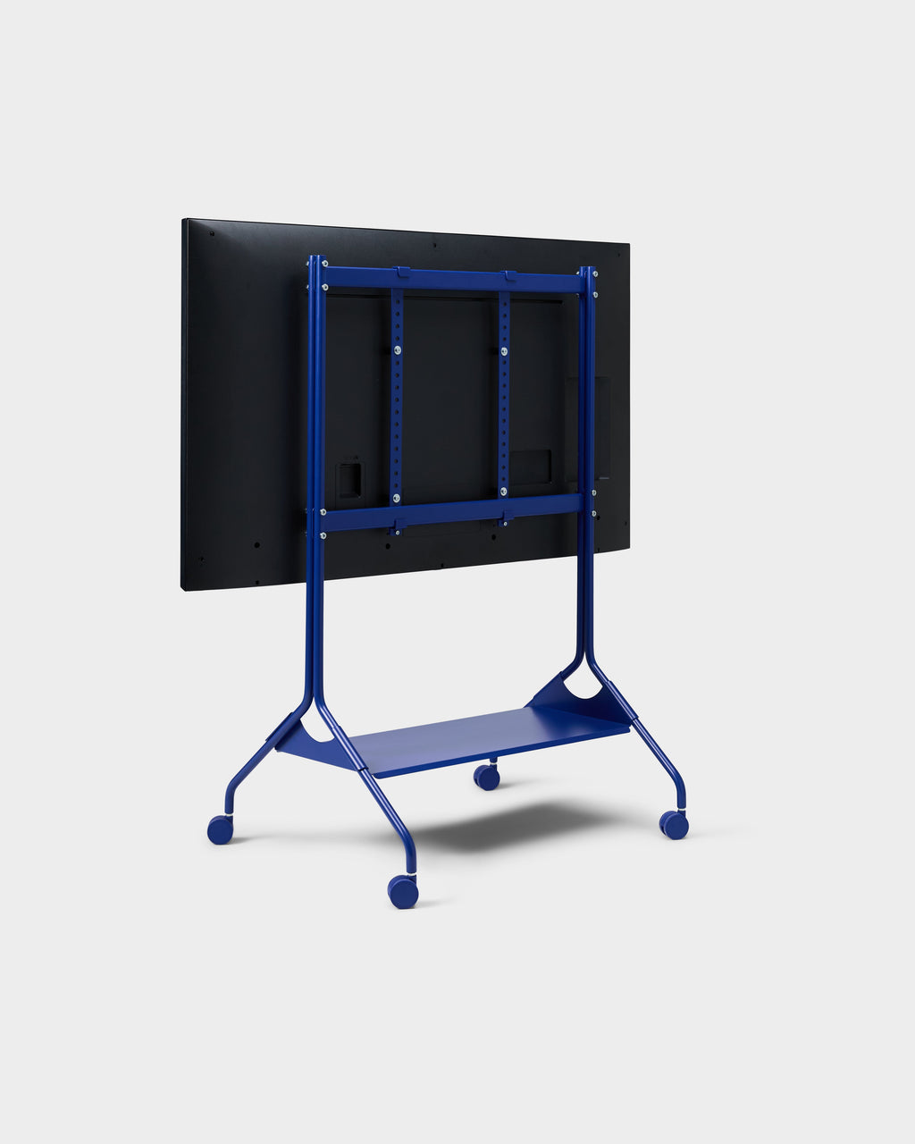 Rear three-quarter studio view of Moon Tall stand in Ultra Marine with mounted display, VESA brackets, shelf and wheels