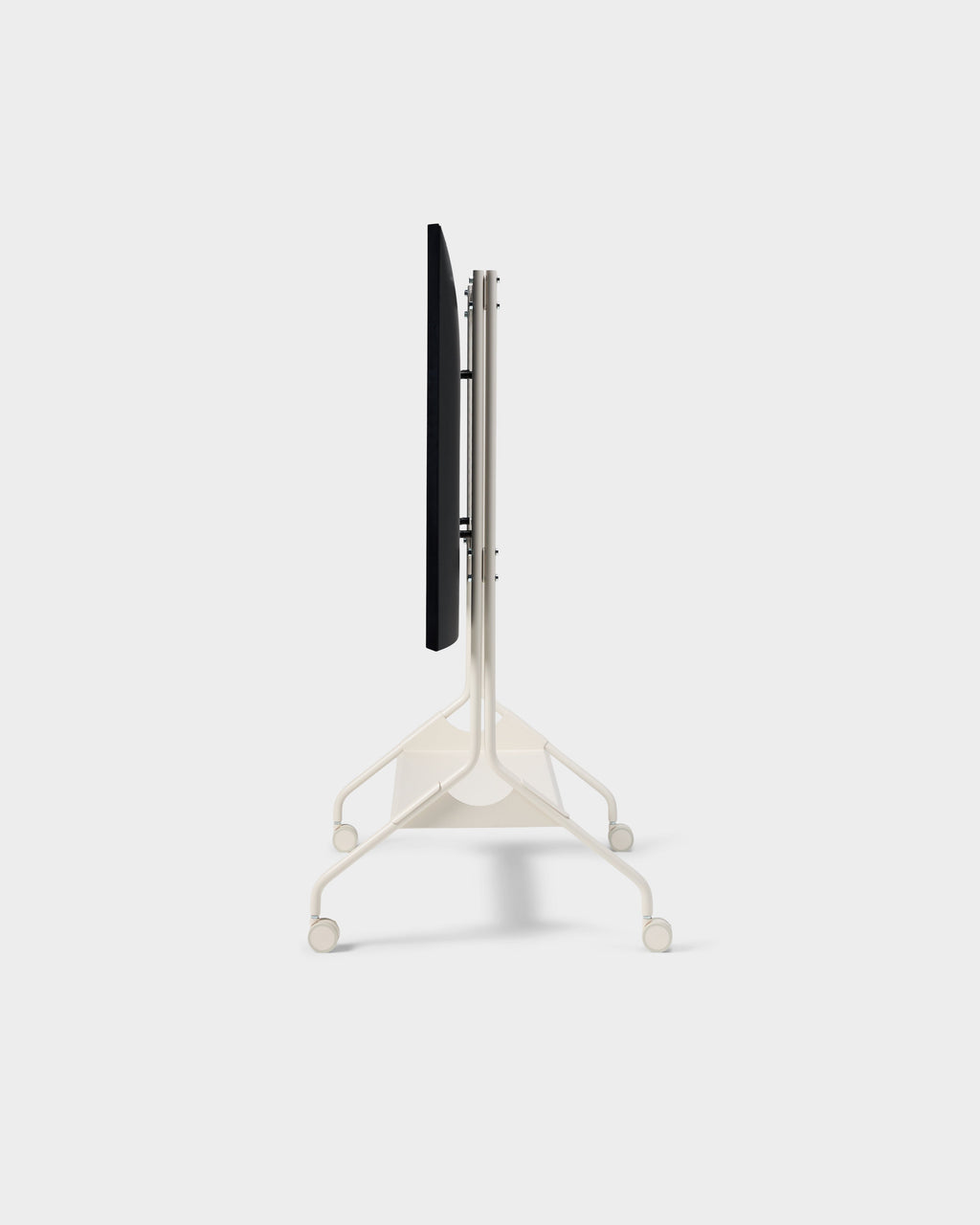 Side profile of Moon Tall stand in Pearl with mounted TV, showing slim frame, tripod base and wheels on studio white
