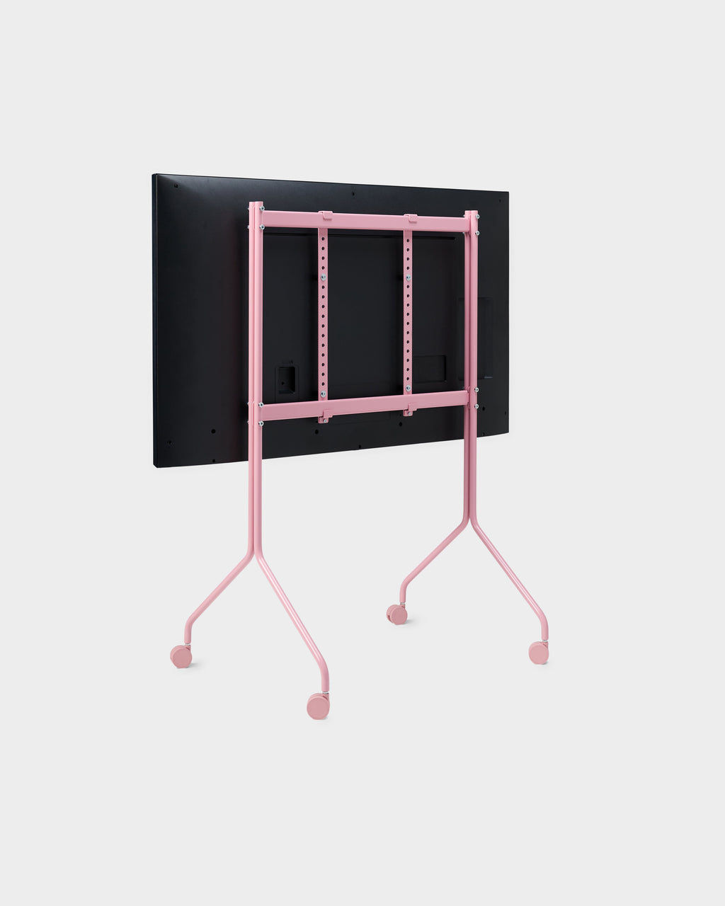 Rear three-quarter view of Moon Tall stand in Bubble Gum pink with mounted TV and casters, studio packshot