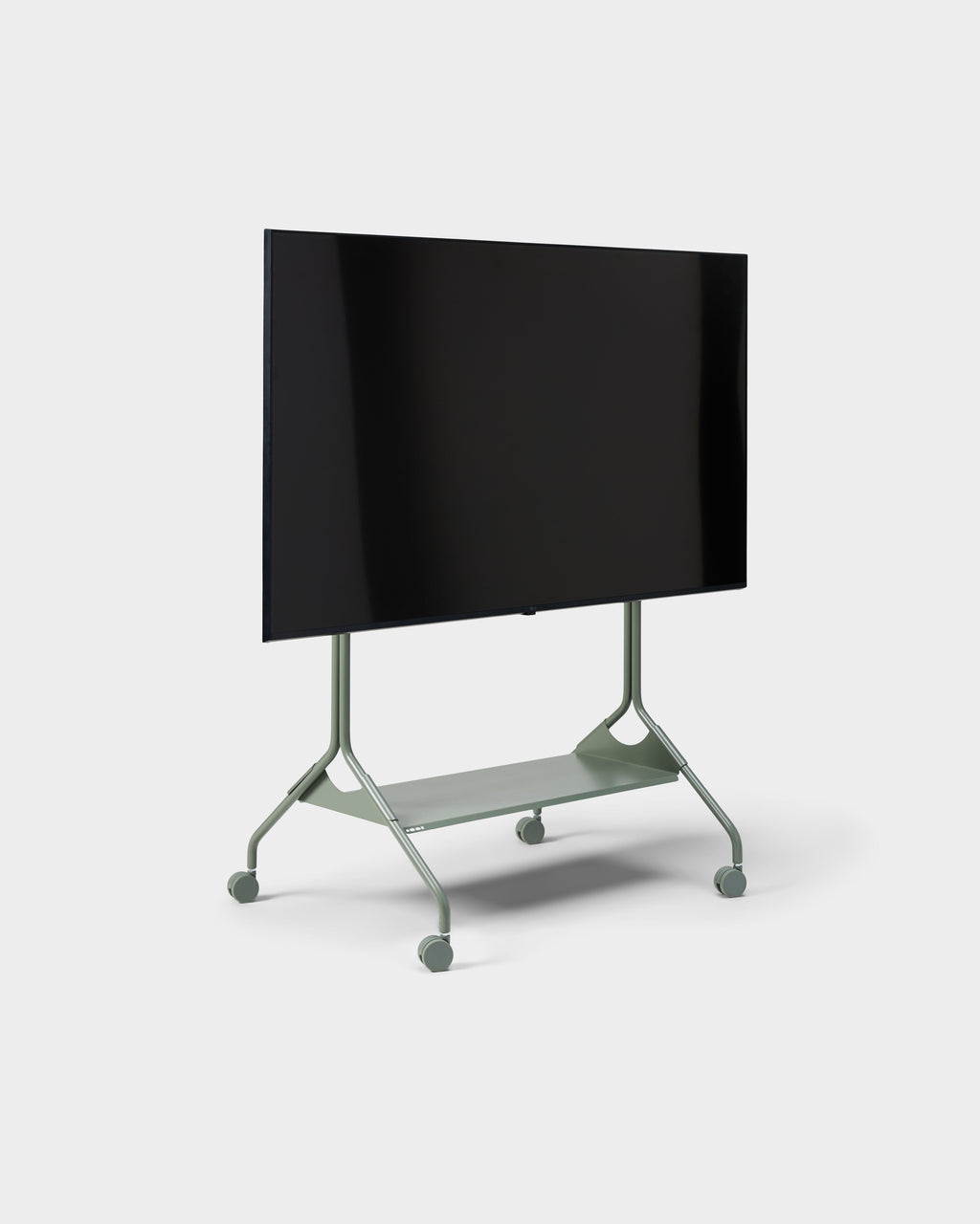Moon Tall stand in Mossy Green shown at a three-quarter angle with mounted flat-screen TV, shelf and wheels