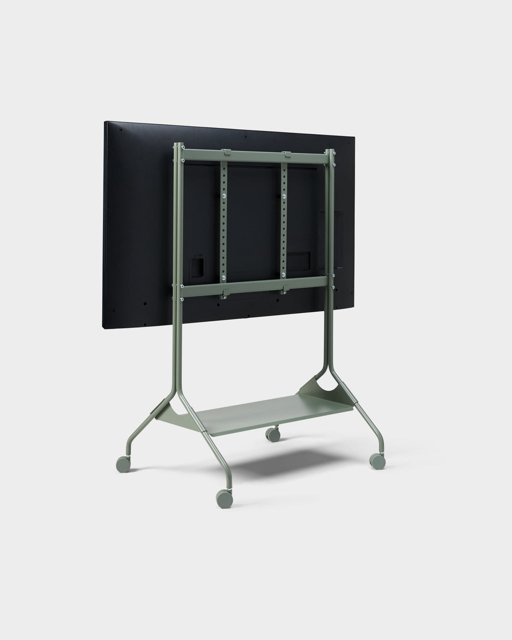 Rear three-quarter view of Moon Tall stand in Mossy Green with mounted display, shelf and wheels on studio backdrop