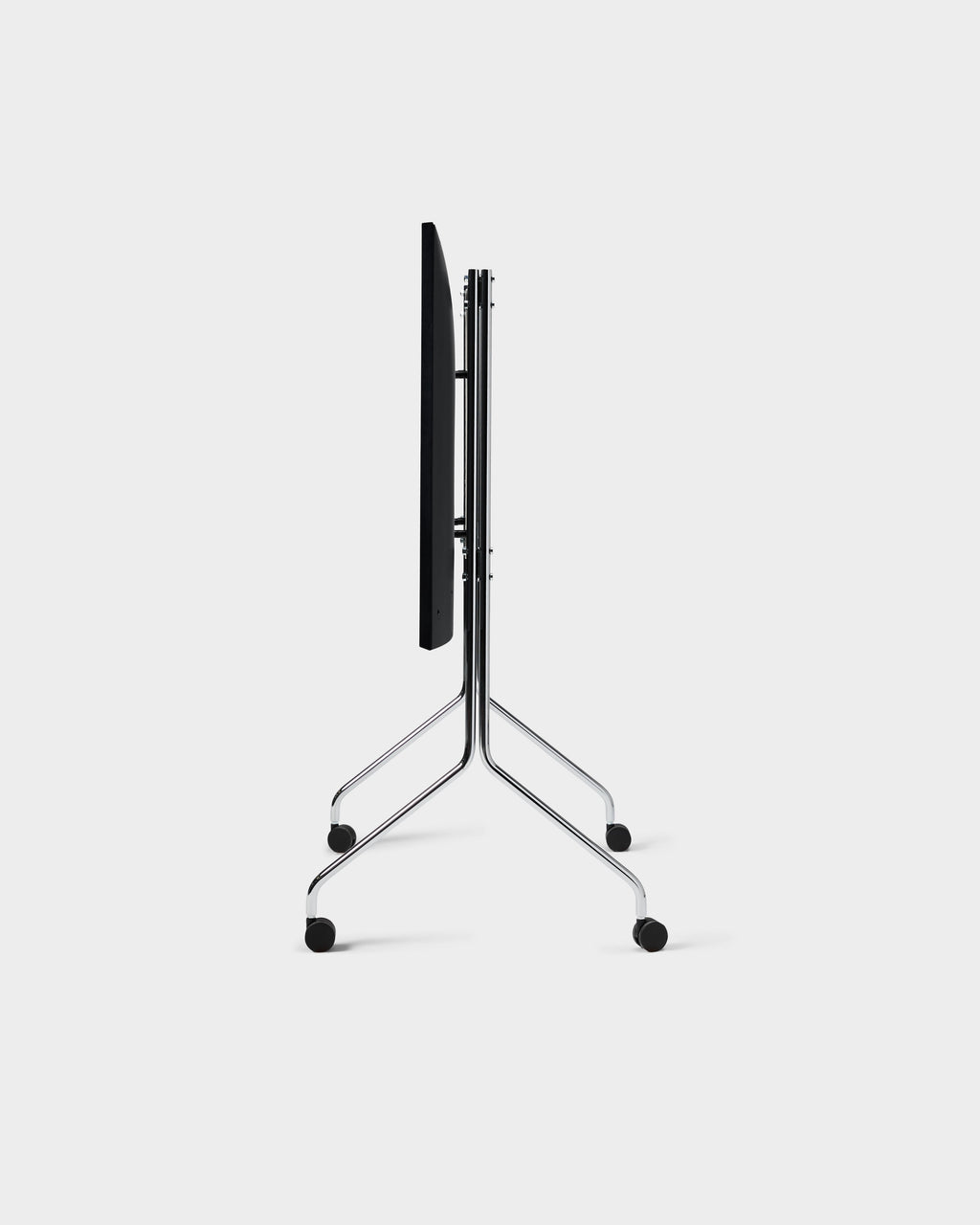Moon Tall TV stand in Chrome, side-profile studio packshot showing folded black panel, slim tubular legs and black wheels
