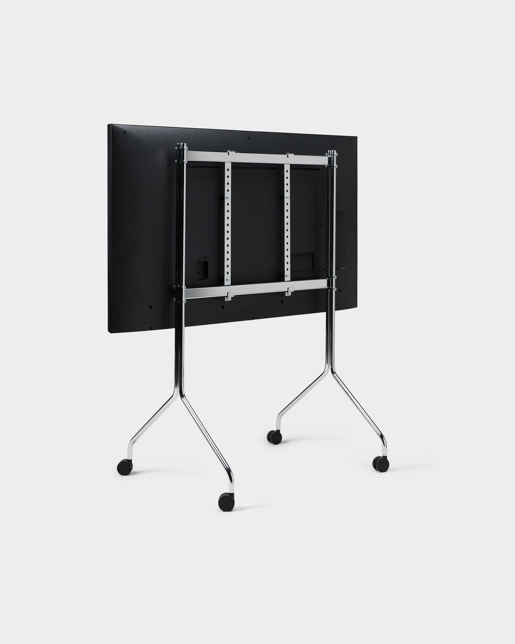 Rear three-quarter view of the Moon Tall stand in chrome with mounted display, showing VESA brackets and casters
Mor
Wait — reply...