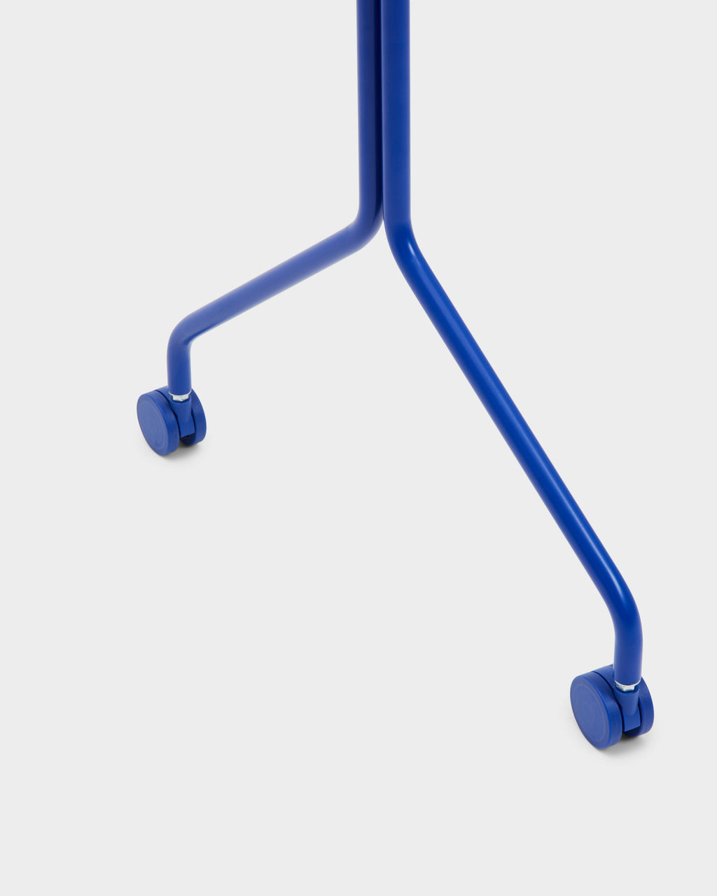 Close-up studio packshot of Ultra Marine blue steel legs with matching caster Wheels on a pale grey background