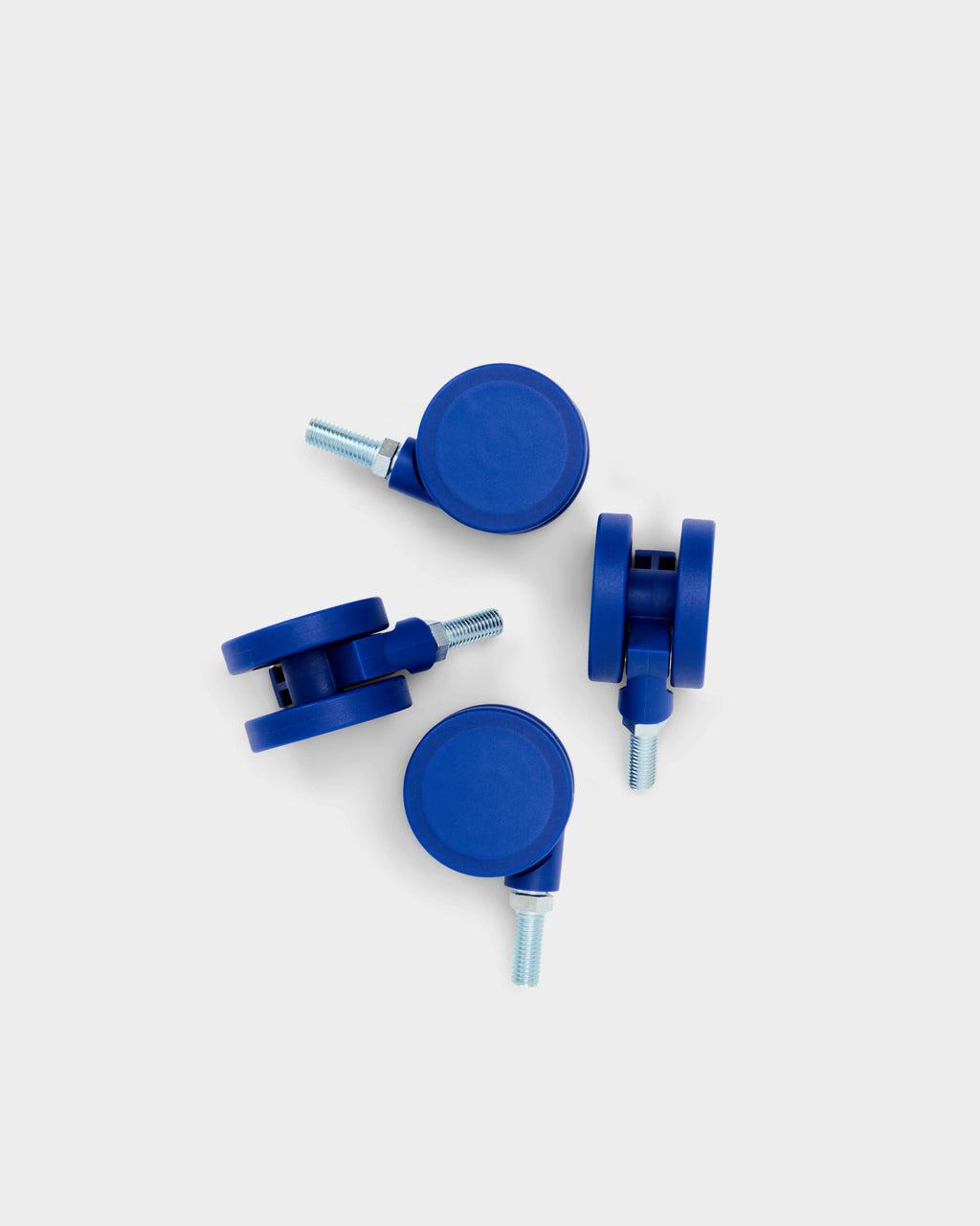 Set of four Ultra Marine blue caster wheels with threaded metal stems, studio packshot on light grey background