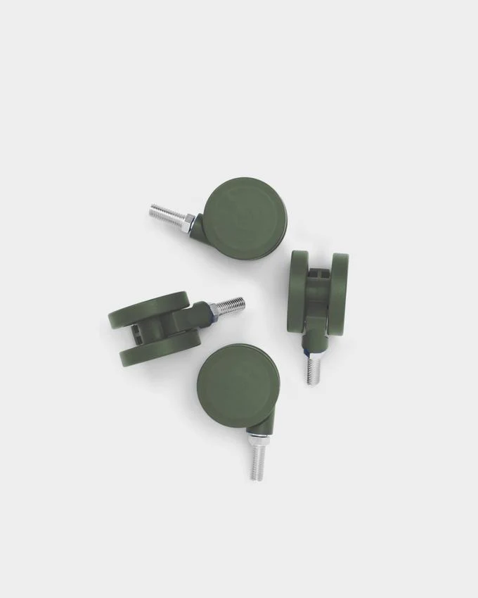 Set of four Wheels in Mossy Green arranged on a white studio background, showing threaded screw stems and dual casters