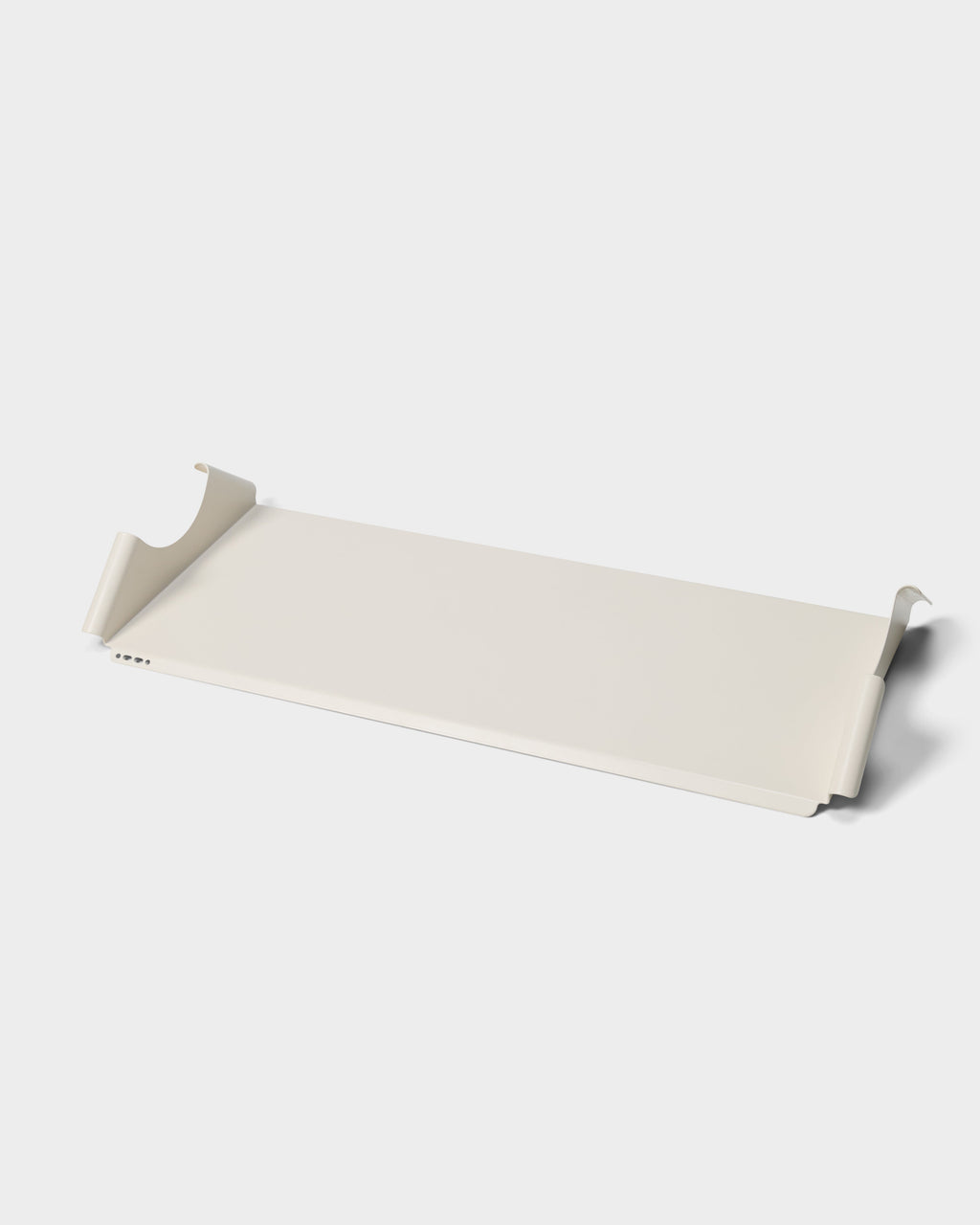 Moon Tray Shelf in Pearl shown at an angle in a studio packshot, revealing curved side hooks and mounting holes