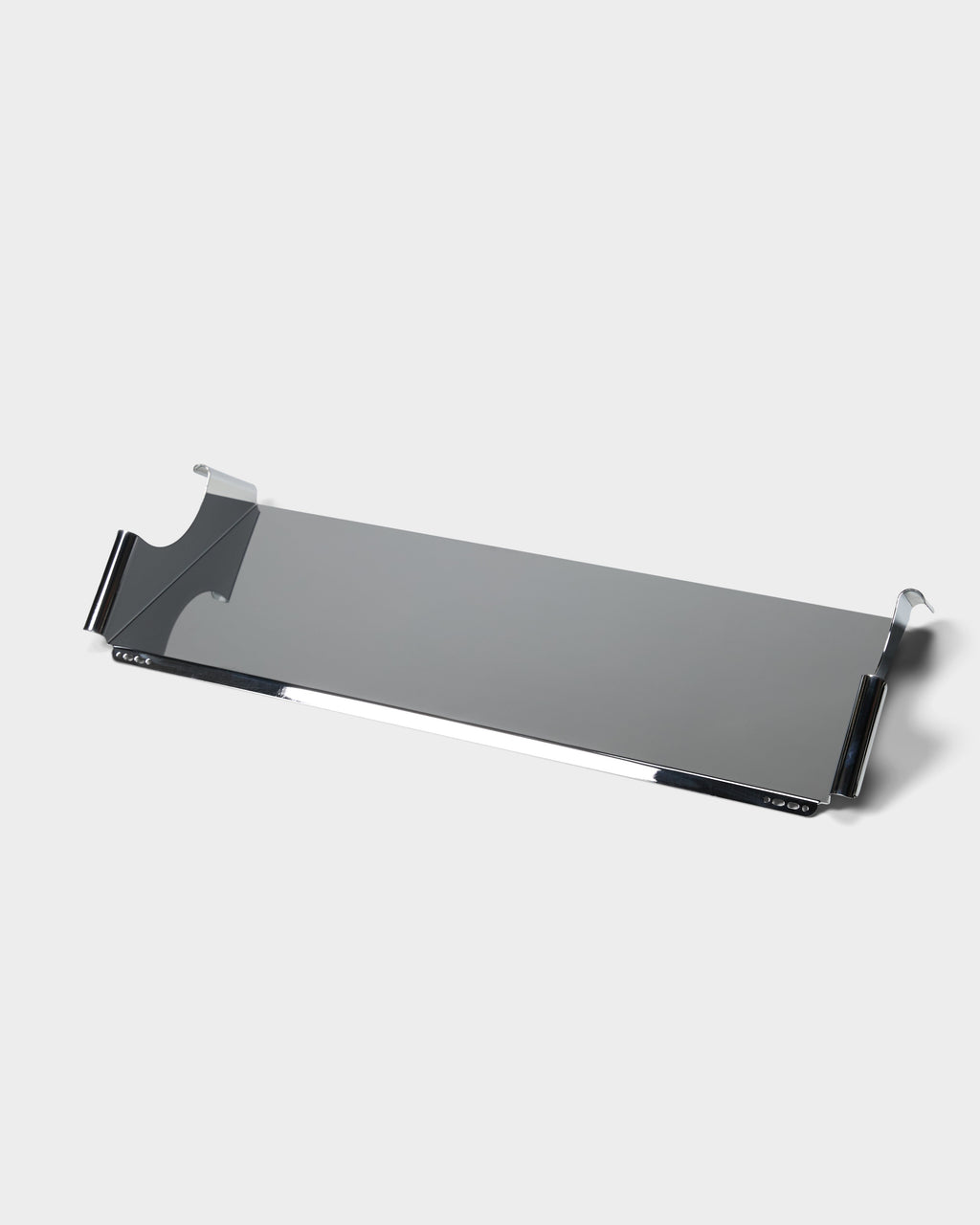 Moon Tray Shelf in Chrome shown at an angle in a studio packshot, highlighting its polished tray and hook brackets