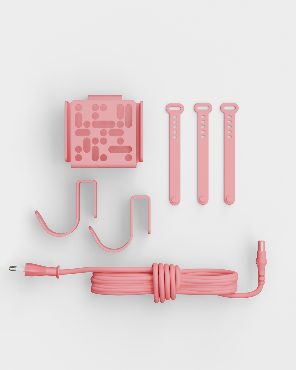 Bubble Gum pink Mount Bundle laid flat in a studio packshot with wall bracket, hooks, cable ties and power cord