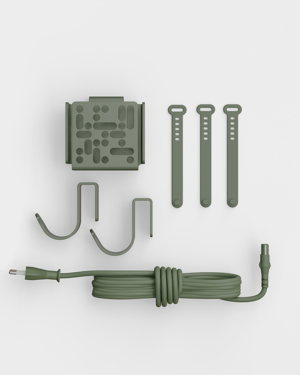 Mount Bundle in Mossy Green laid flat in studio packshot: wall plate, two hooks, three cable straps and coiled cord