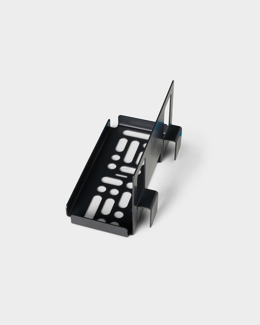 Charcoal PS5 Slim Mount shown at an angle in a studio packshot, revealing its slotted tray and bracket arms