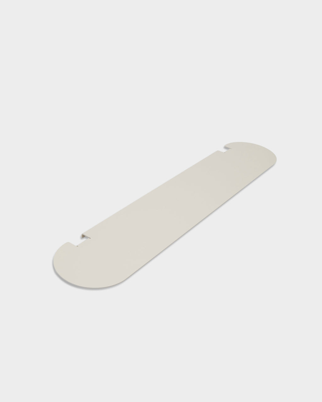Moon Shelf in Pearl shown at an angle as a studio packshot, highlighting its rounded ends and notched edges