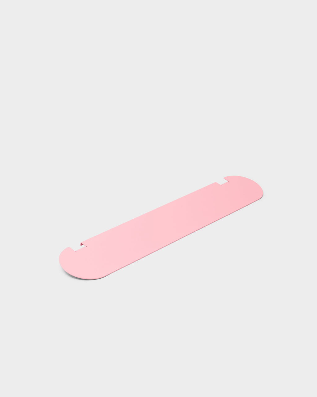 Moon Shelf in Bubble Gum pink shown at an angle in a studio packshot, highlighting its rounded ends and notched edges