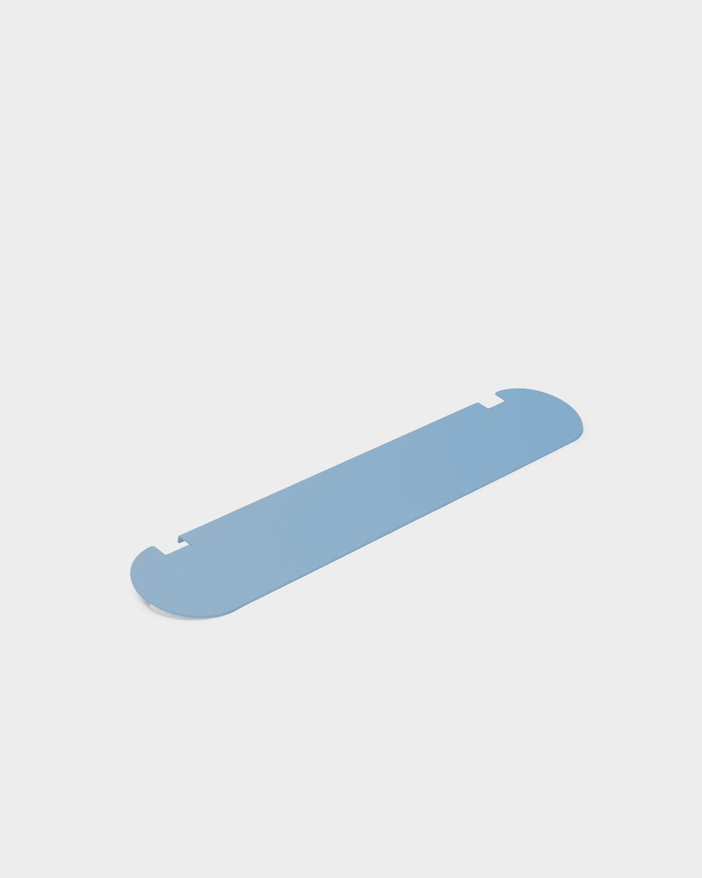 Moon Shelf in Powder Blue shown at an angle in a studio packshot, highlighting its rounded ends and notched edges