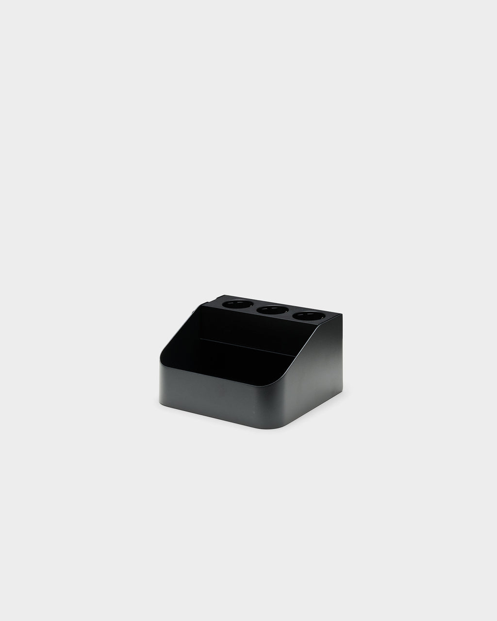 Charcoal Power Bar Tray angled studio view showing three outlet openings and open front storage compartment