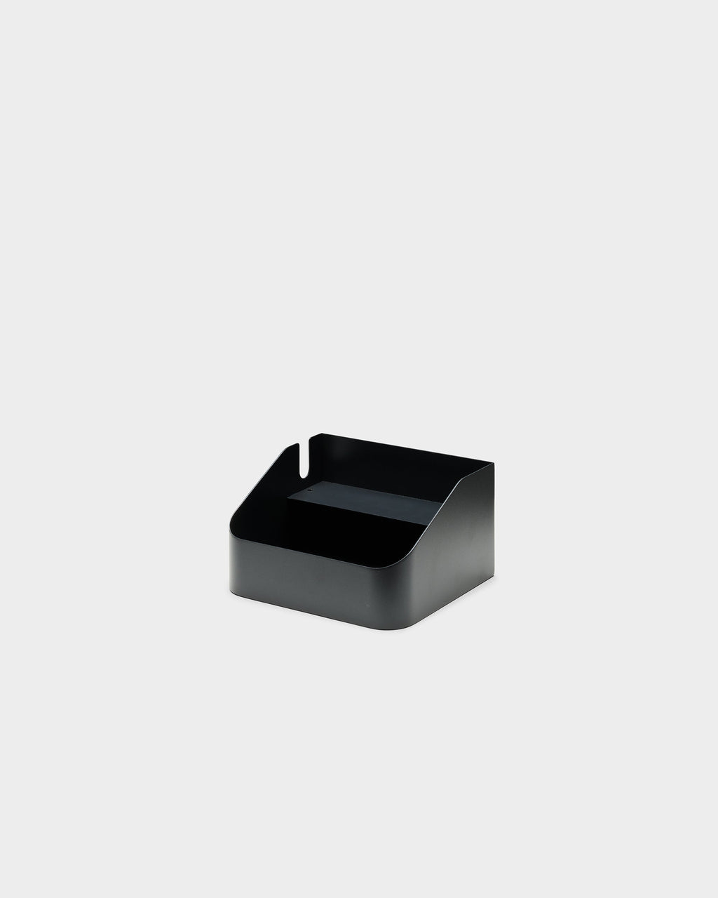 Charcoal Power Bar Tray shown at a three-quarter angle in a studio packshot, revealing its open top and cord notch